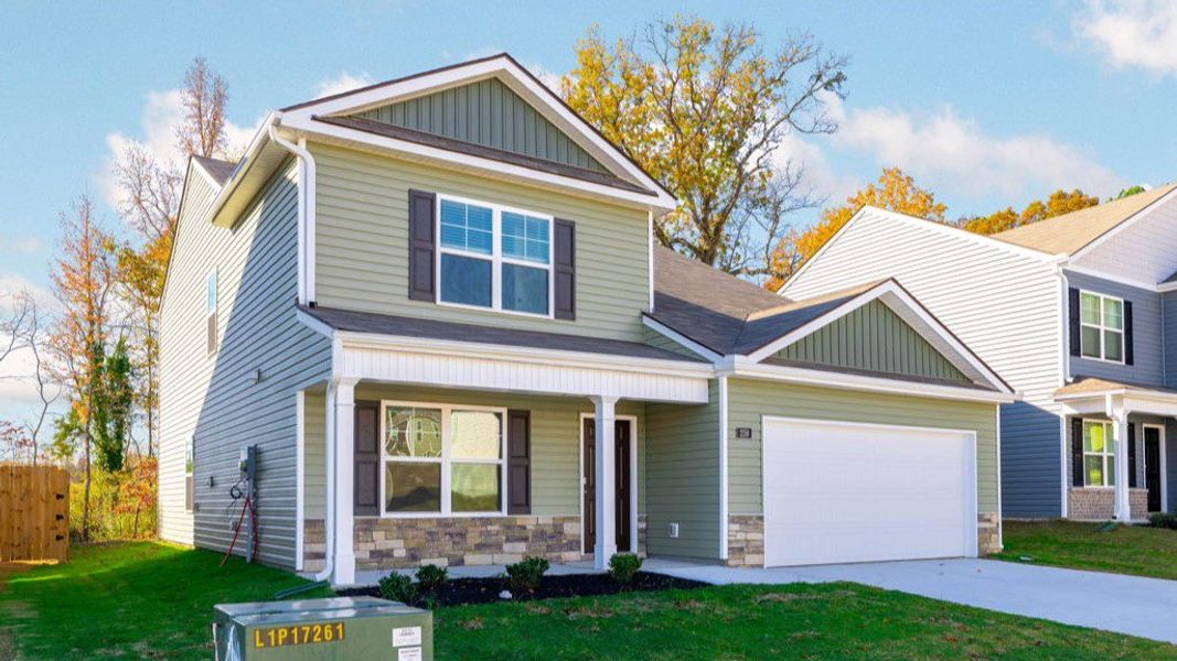 Front exterior of a new home in Hawk's Ridge, Rossville, GA, highlighting curb appeal (Image 2).