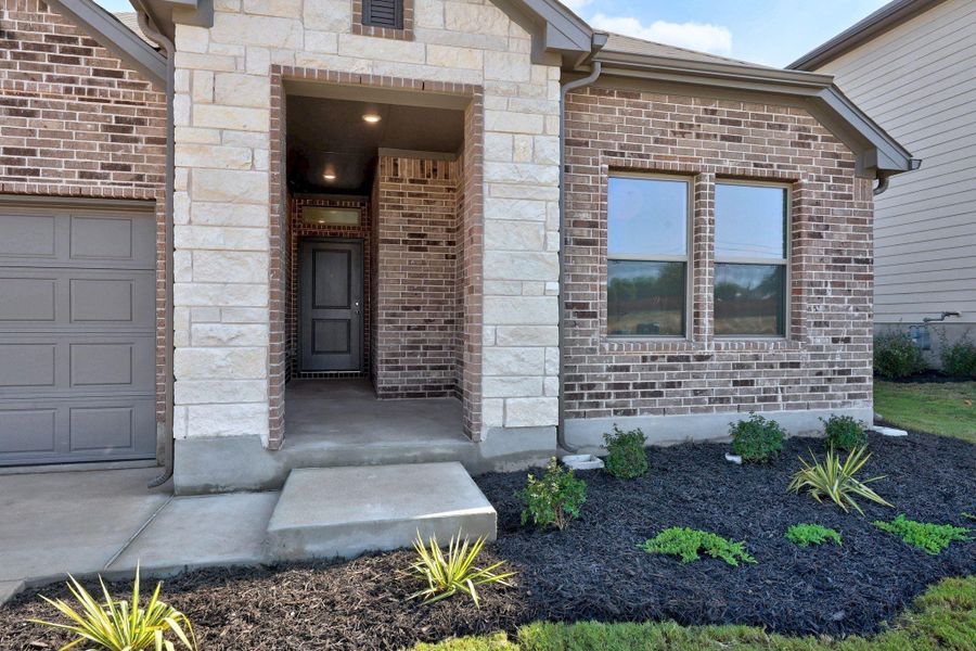 Exterior details and patio area of a home in Prairie Winds, Hutto (Image 1).