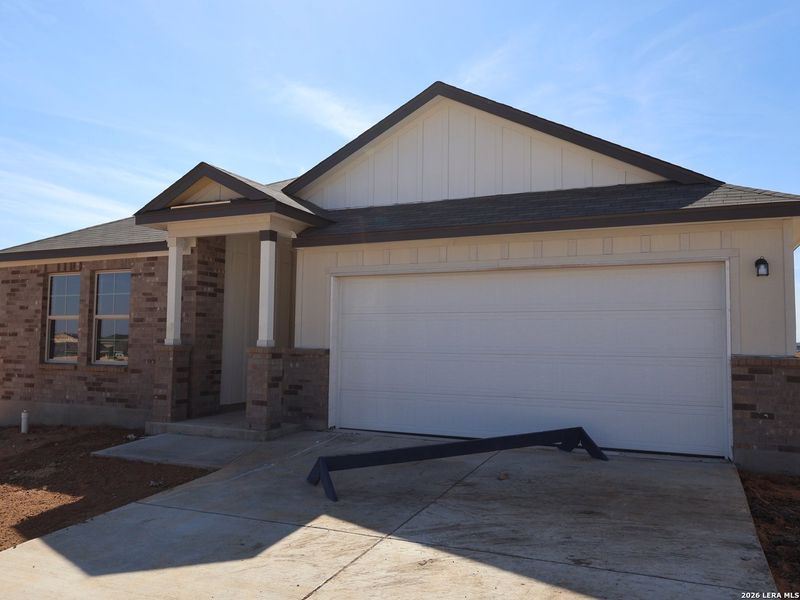 Front exterior of a new home in Paloma Park, Converse, TX, highlighting curb appeal (Image 1). Front exterior of a new home in Paloma Park, Converse, TX, highlighting curb appeal (Image 1).
