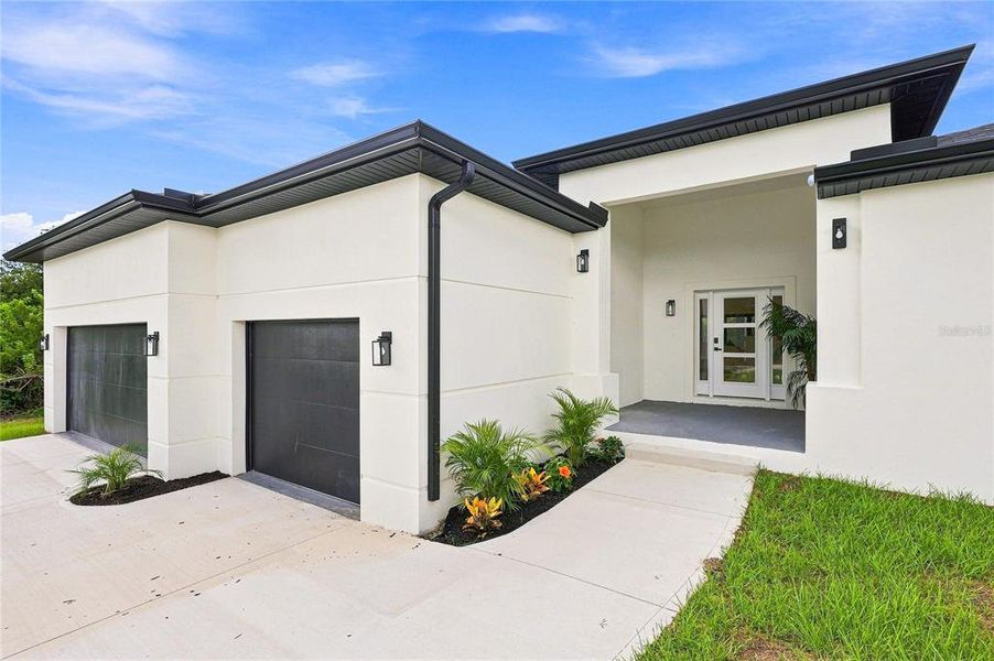 Front exterior of a new home in , Port Charlotte, FL, highlighting curb appeal (Image 32). Front exterior of a new home in , Port Charlotte, FL, highlighting curb appeal (Image 32).