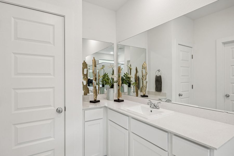 Primary Bathroom in the Trinity home plan by Trophy Signature Homes – REPRESENTATIVE PHOTO