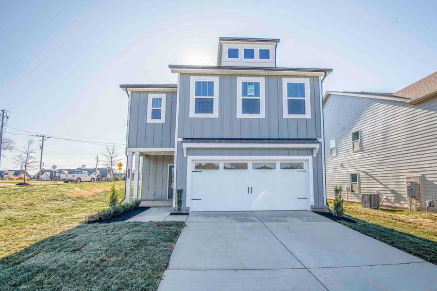 Front exterior of a new home in Ivey Farms - The Grove Collection, Farragut, TN, highlighting curb appeal (Image 2). Front exterior of a new home in Ivey Farms - The Grove Collection, Farragut, TN, highlighting curb appeal (Image 2).