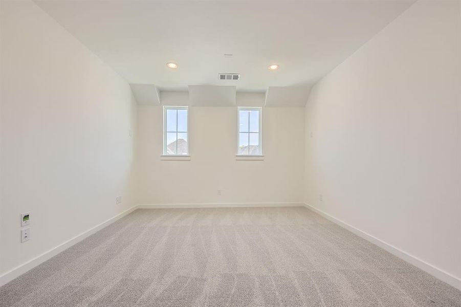 Empty room featuring baseboards, light colored carpet, and recessed lighting Empty room featuring baseboards, light colored carpet, and recessed lighting