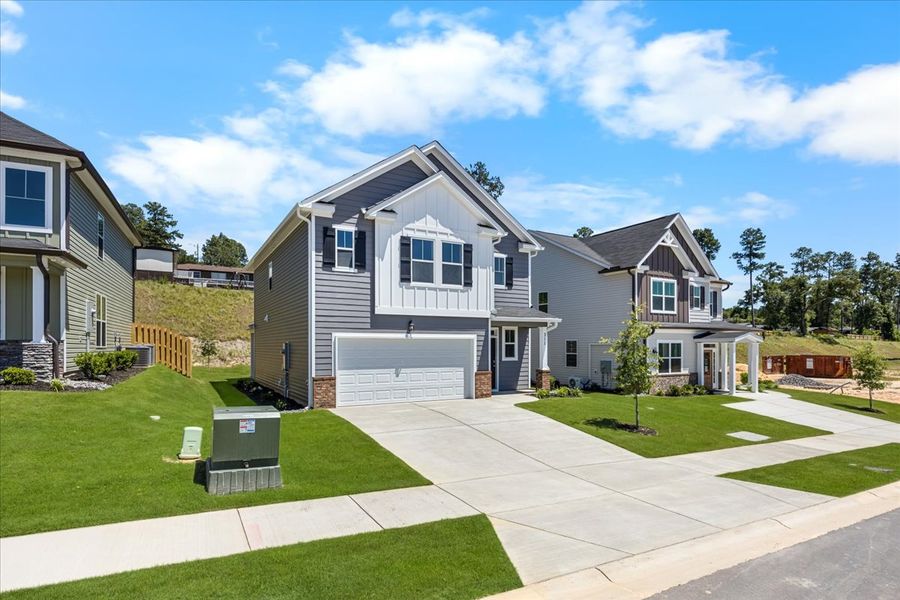 Front exterior of a new home in Forrest Bluff, North Augusta, SC, highlighting curb appeal (Image 20). Front exterior of a new home in Forrest Bluff, North Augusta, SC, highlighting curb appeal (Image 20).