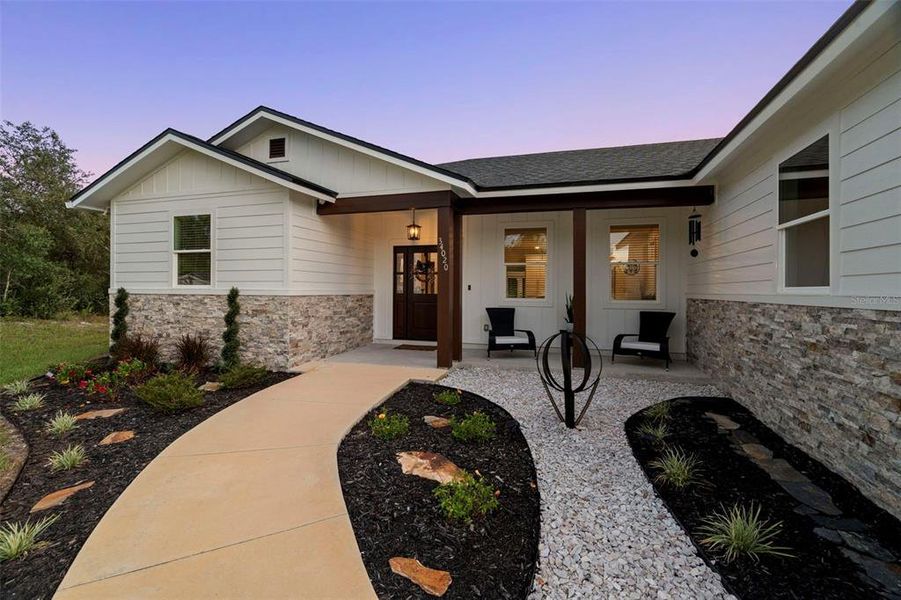 Front exterior of a new home in , Webster, FL, highlighting curb appeal (Image 25).