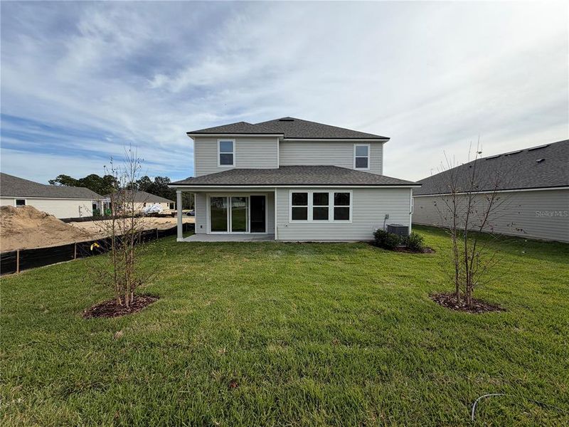 Exterior details and patio area of a home in The Cypress Series at Reserve East, Flagler Beach (Image 27).