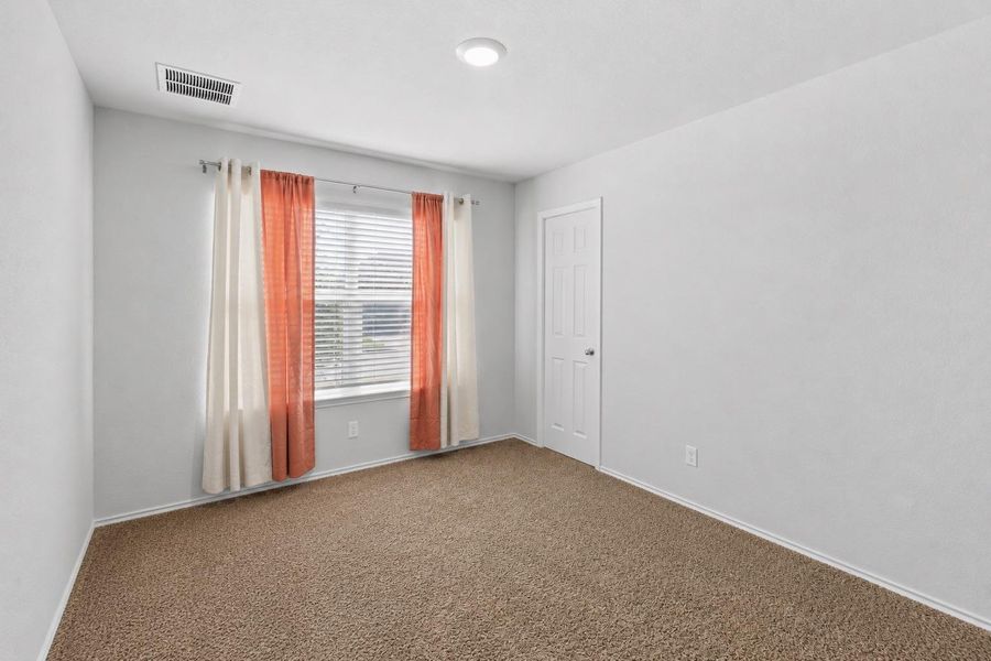 A well-lit room with plush carpeting offers a neutral canvas. A well-lit room with plush carpeting offers a neutral canvas.
