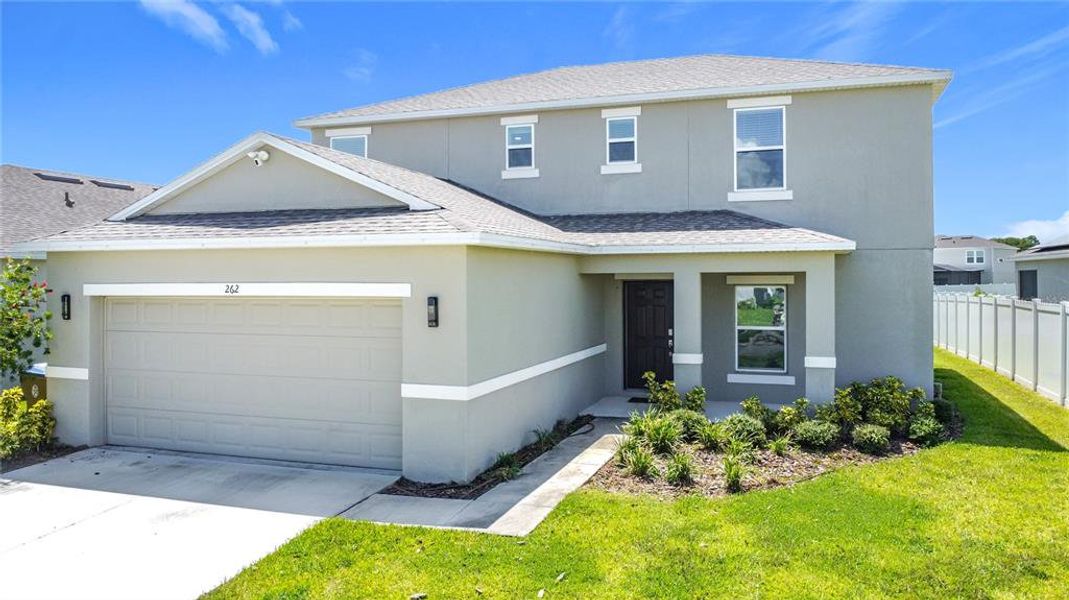 Front exterior of a new home in , Kissimmee, FL, highlighting curb appeal (Image 19).