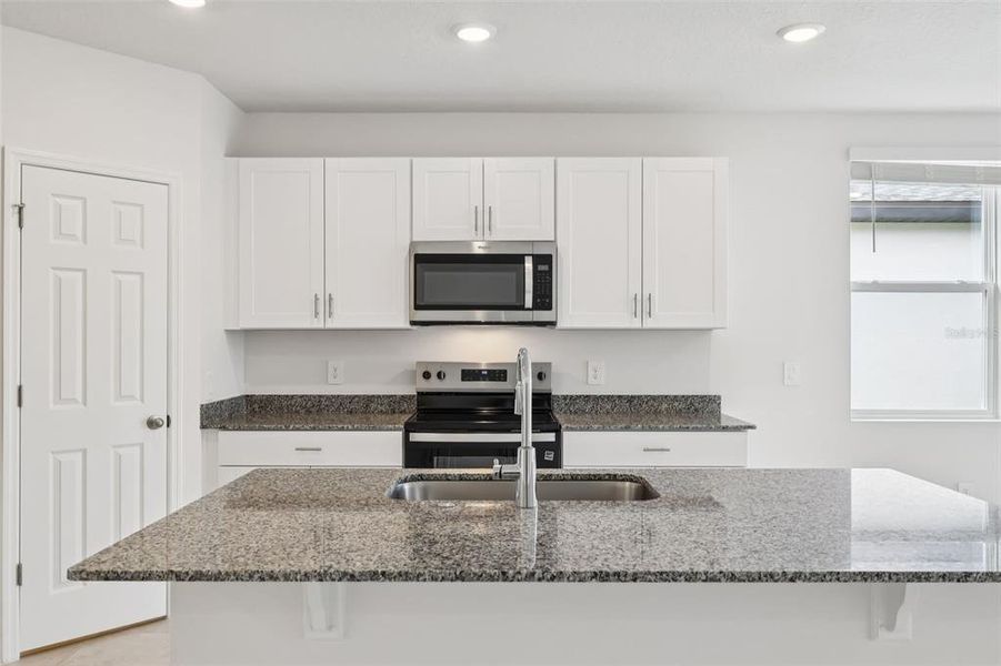 Furnished interior view inside a new home in Lake Deer Estates - Signature Series, Poinciana (Image 6).