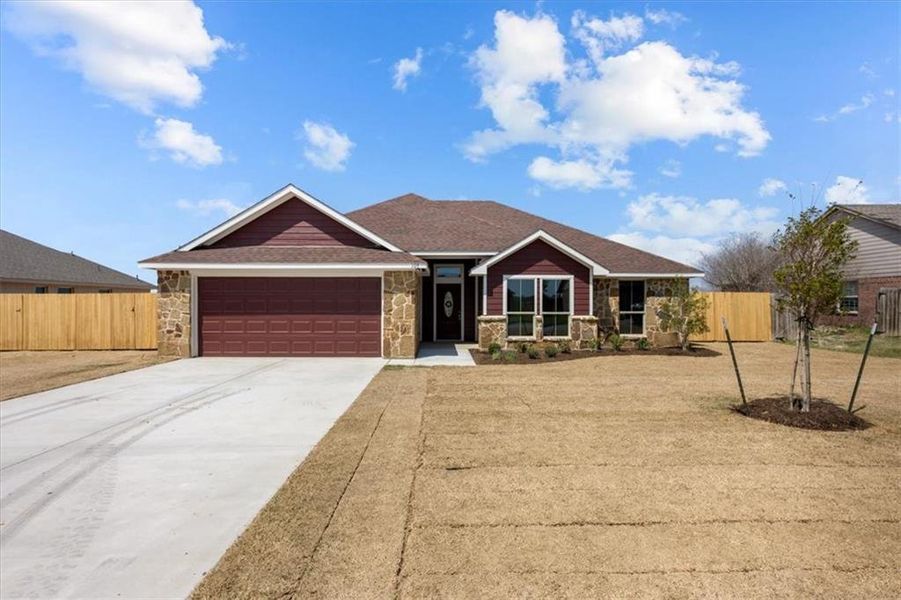 Front exterior of a new home in , Whitney, TX, highlighting curb appeal (Image 1). Front exterior of a new home in , Whitney, TX, highlighting curb appeal (Image 1).