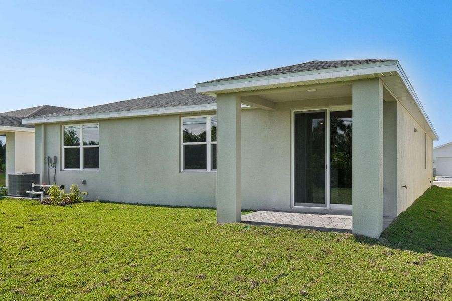 Exterior details and patio area of a home in Hampton Park - Classic Series, Vero Beach (Image 19).