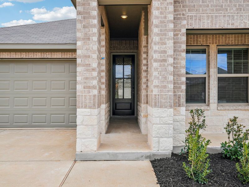 Exterior details and patio area of a home in Lark Canyon, New Braunfels (Image 3).