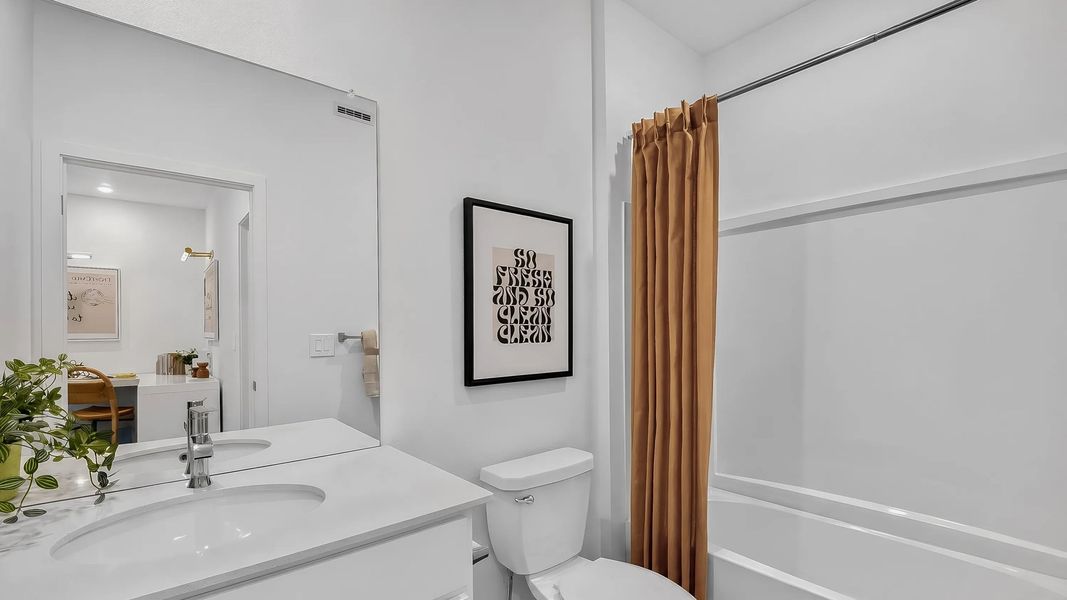 Full bathroom with a sink and shower-tub combo Full bathroom with a sink and shower-tub combo