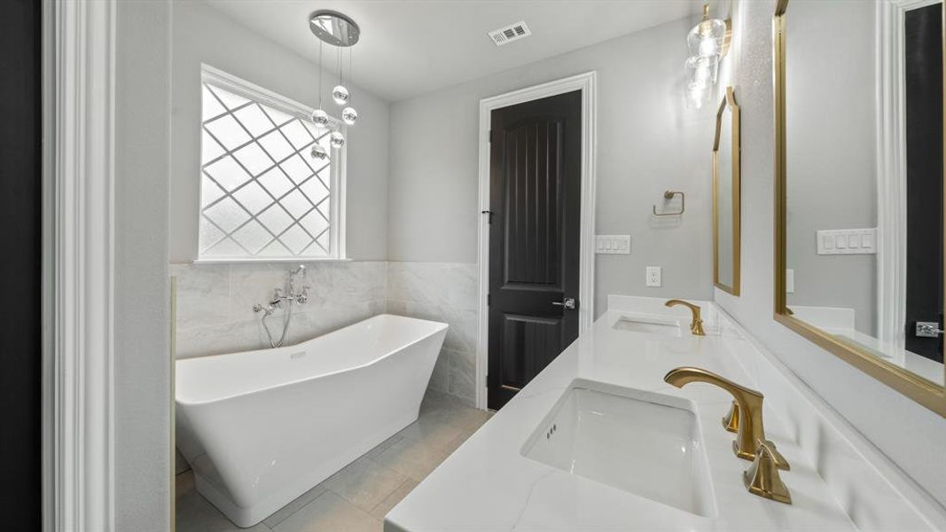 Primary Bathroom with freestanding seamless bathtub