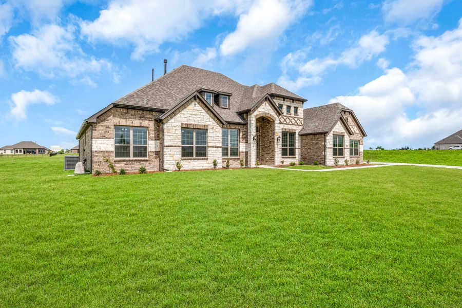 Front exterior of a new home in Creekview Farms, Greenville, TX, highlighting curb appeal (Image 24). Front exterior of a new home in Creekview Farms, Greenville, TX, highlighting curb appeal (Image 24).