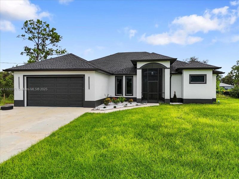 Front exterior of a new home in , Labelle, FL, highlighting curb appeal (Image 21).