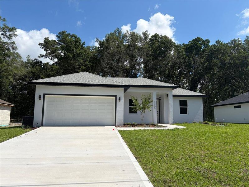 Front exterior of a new home in , Dunnellon, FL, highlighting curb appeal (Image 2). Front exterior of a new home in , Dunnellon, FL, highlighting curb appeal (Image 2).