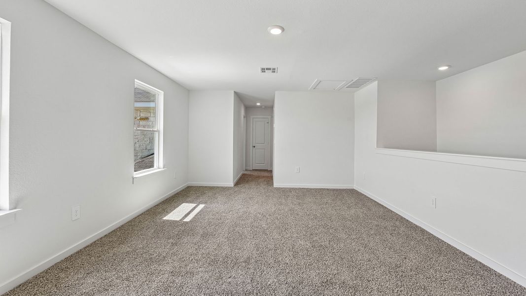 Spacious, unfurnished interior of a new home in Monarch Ranch, Manor (Image 36).
