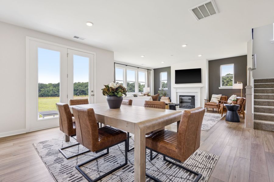 A dining room with a large table. A dining room with a large table.
