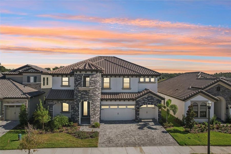 Front exterior of a new home in Hawkstone, Lithia, FL, highlighting curb appeal (Image 1). Front exterior of a new home in Hawkstone, Lithia, FL, highlighting curb appeal (Image 1).