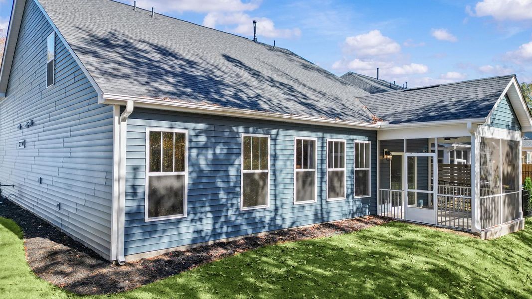 Warm and inviting outdoor living space with a screened rear porch and tasteful finishes Warm and inviting outdoor living space with a screened rear porch and tasteful finishes