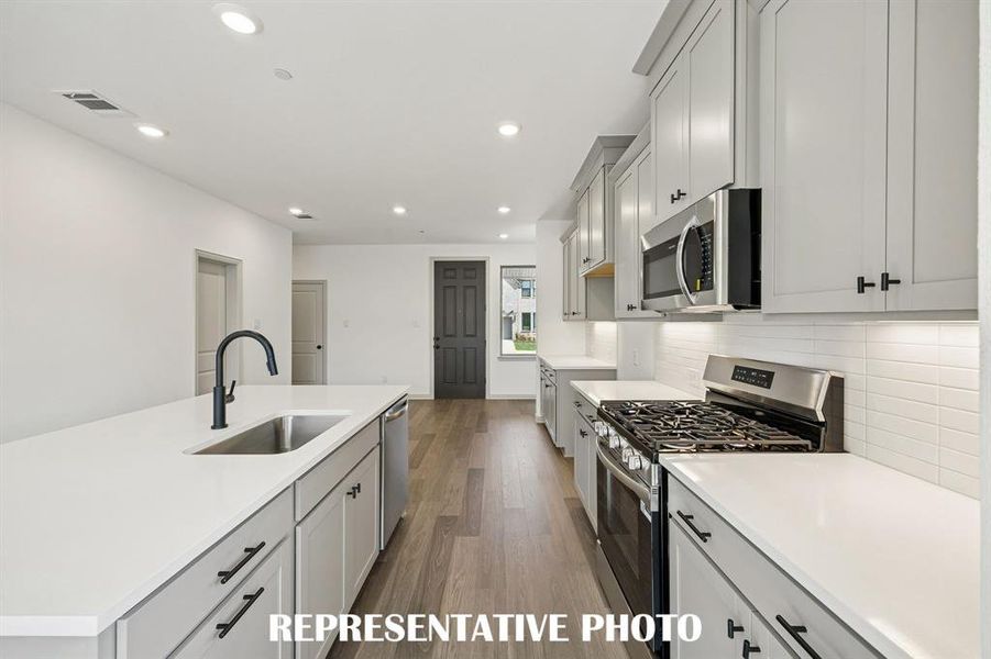 Gorgeous design elements are everywhere you look in this chef's kitchen!  REPRESENTATIVE PHOTO