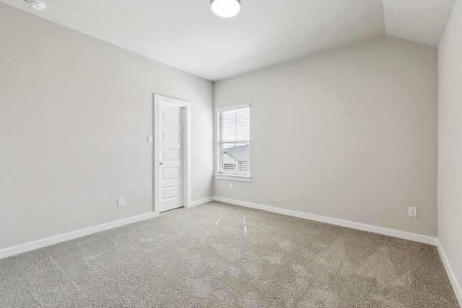 Bedroom in the Stanley II home plan by Trophy Signature Homes – REPRESENTATIVE PHOTO