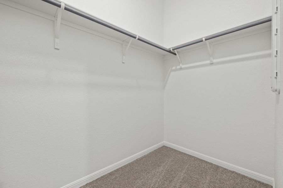 Primary Closet in the Birch home plan by Trophy Signature Homes – REPRESENTATIVE PHOTO