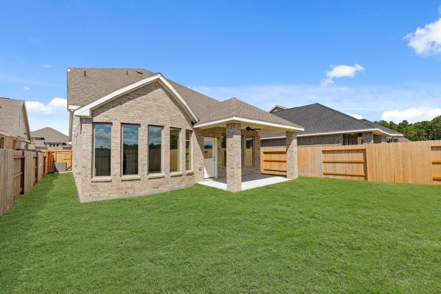 Exterior details and patio area of a home in The Trails, New Caney (Image 22).