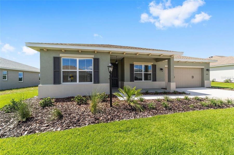 Front exterior of a new home in On Top of the World Communities, Ocala, FL, highlighting curb appeal (Image 16). Front exterior of a new home in On Top of the World Communities, Ocala, FL, highlighting curb appeal (Image 16).