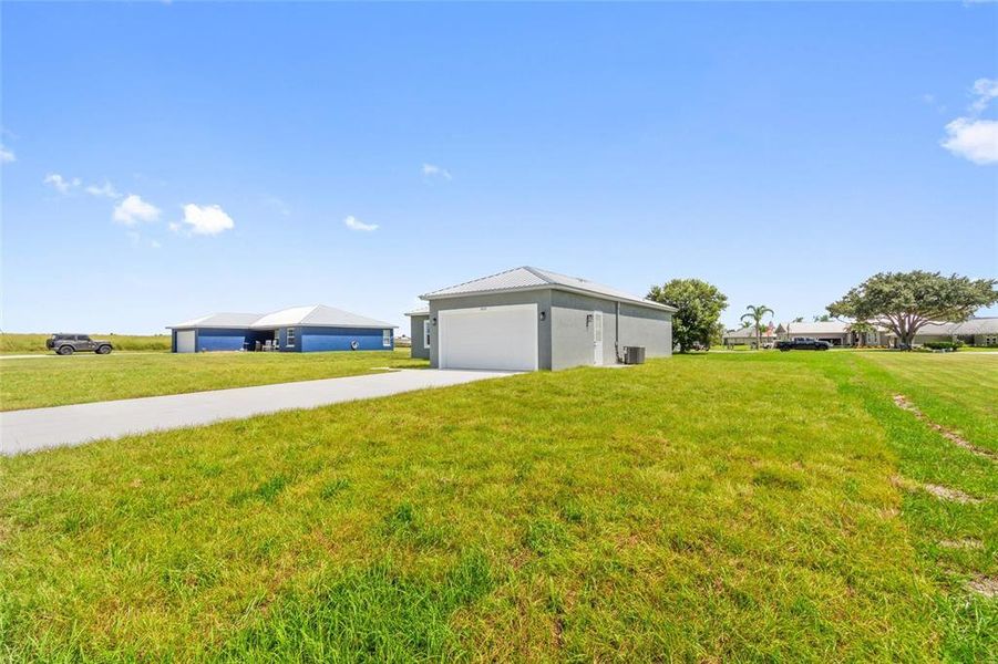 Front exterior of a new home in , Fort Meade, FL, highlighting curb appeal (Image 17).