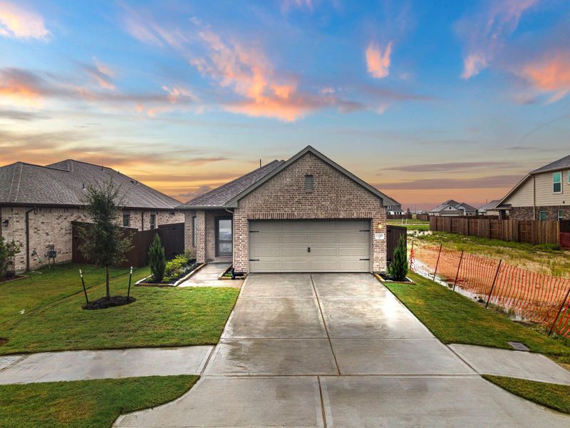 Front exterior of a new home in Creekhaven, Rosharon, TX, highlighting curb appeal (Image 20).