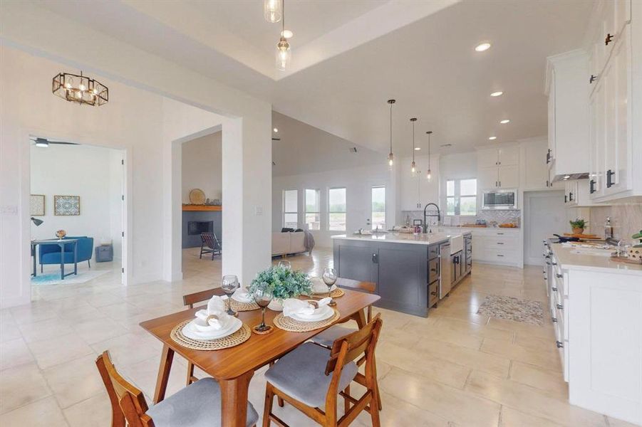 Dining area featuring recessed lighting and light tile patterned floors Dining area featuring recessed lighting and light tile patterned floors