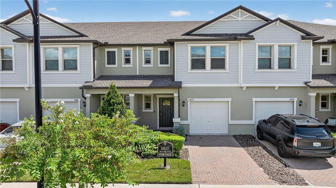 Front exterior of a new home in , Land O' Lakes, FL, highlighting curb appeal (Image 27).