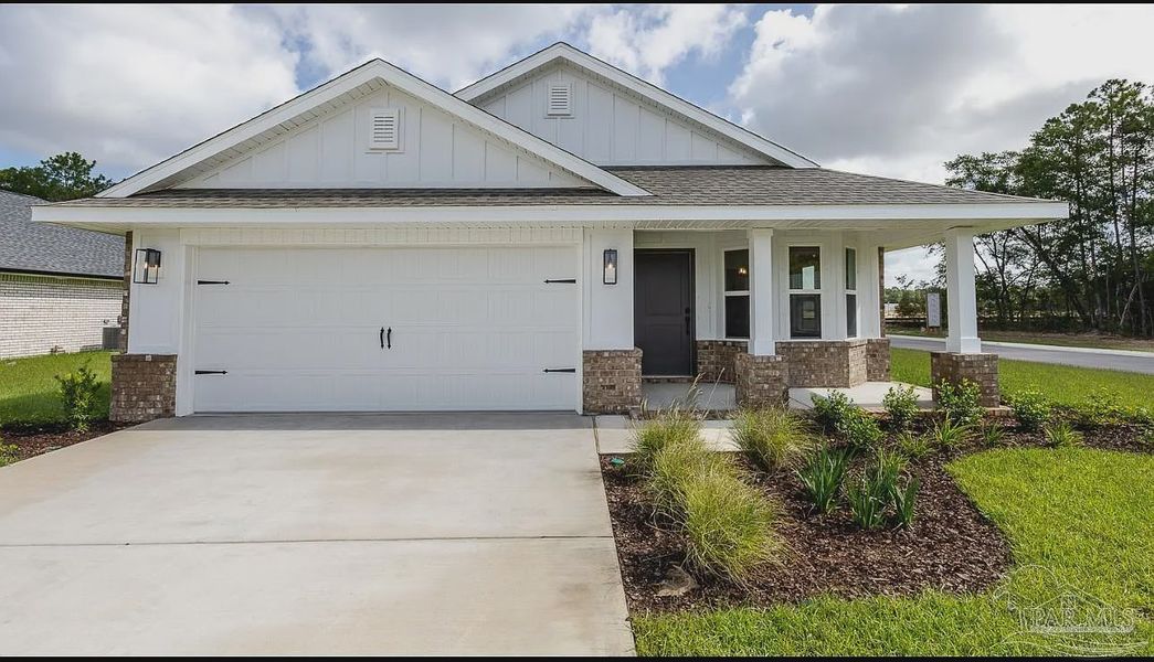 Front exterior of a new home in Hidden Pines, Milton, FL, highlighting curb appeal (Image 1).