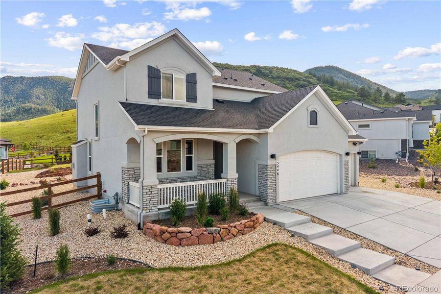 Front exterior of a new home in , Monument, CO, highlighting curb appeal (Image 18).