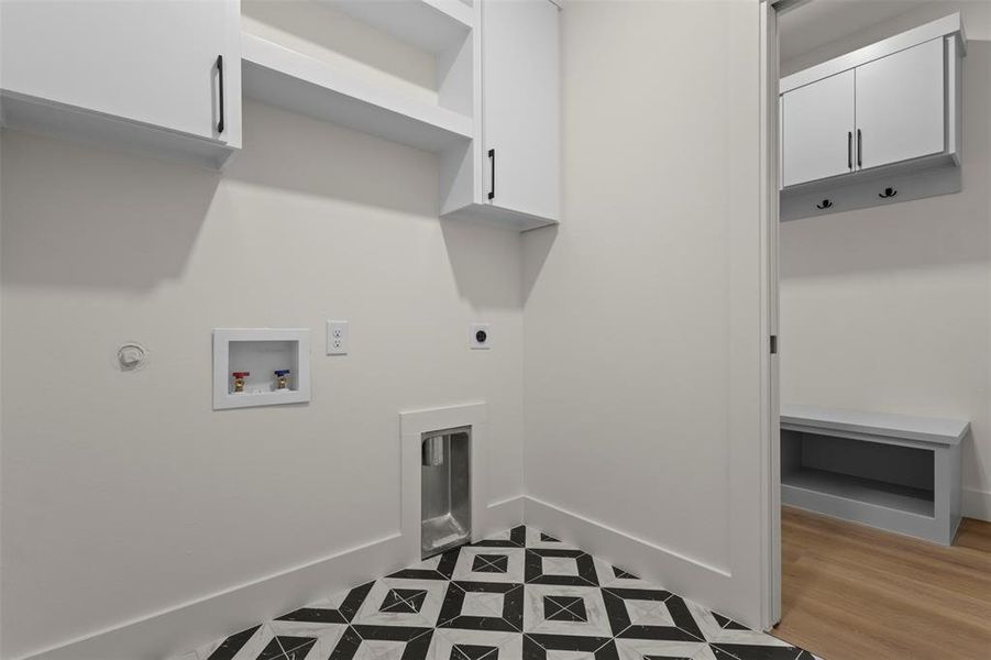 Laundry area featuring electric dryer hookup, washer hookup, cabinet space, gas dryer hookup, and light floors