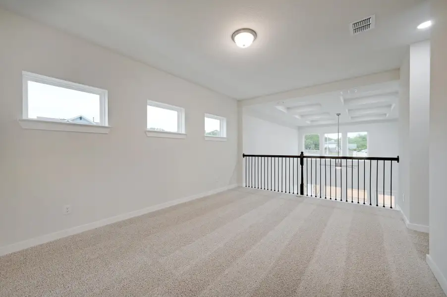 Representative unfurnished interior of a home built from the Travis by Scott Felder Homes in Flora, Hutto (Image 18).