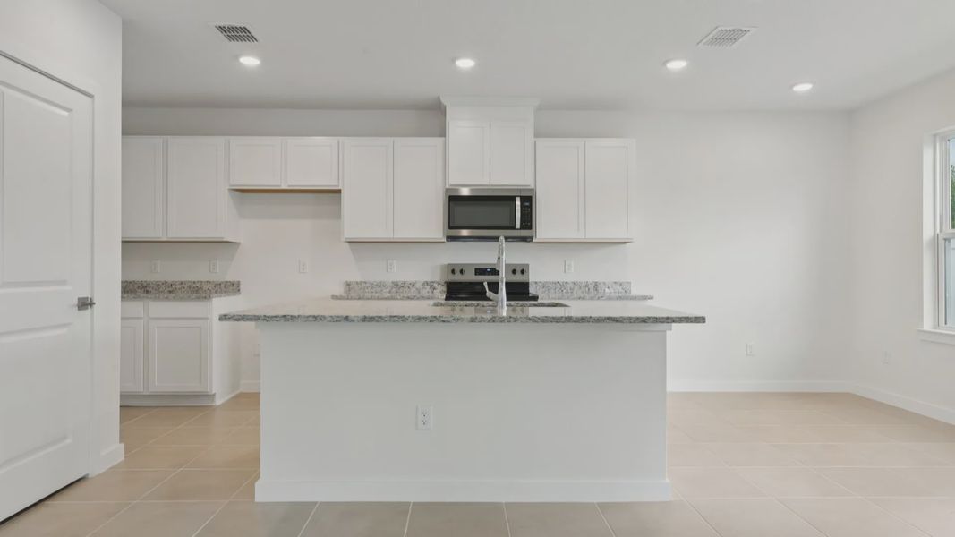 Kitchen of the Coronado - End at Cyrene at Harmony located in St Cloud FL by DRB Homes
