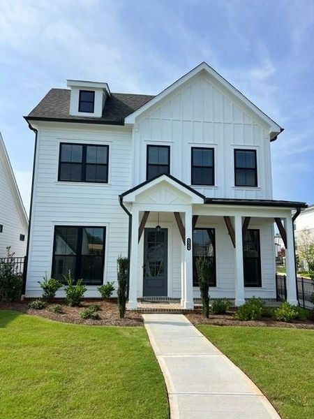 Front exterior of a new home in Promenade at Sawnee Village, Cumming, GA, highlighting curb appeal (Image 24).