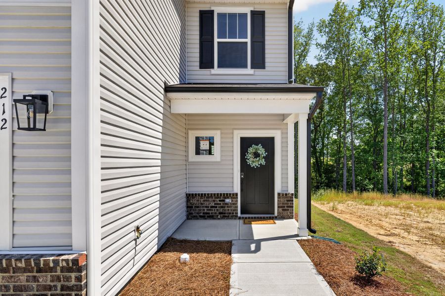 Exterior details and patio area of a home in White Oak Creek Crossing, Angier (Image 2).