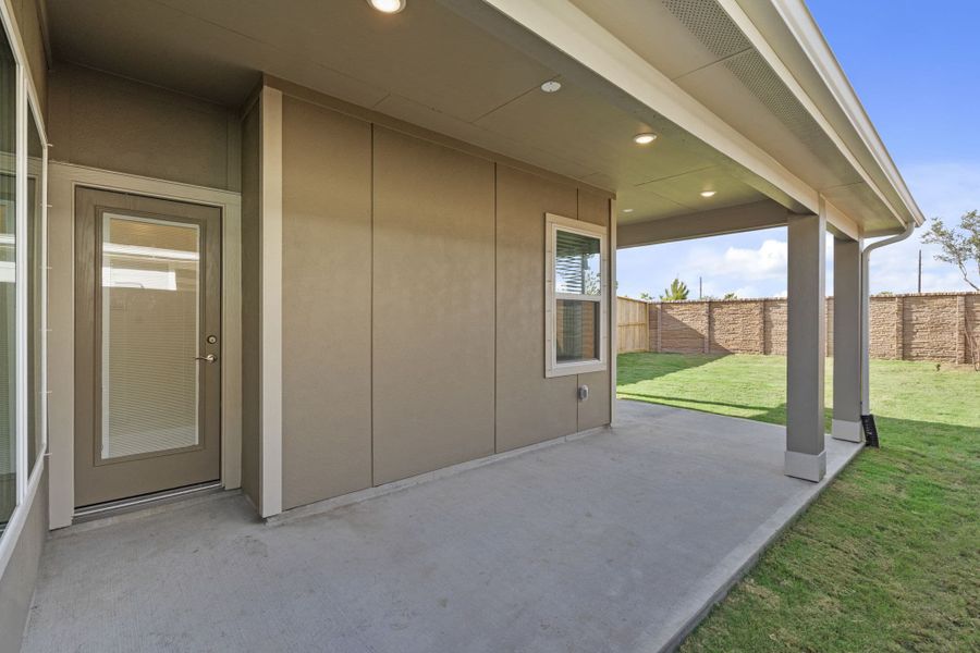 Exterior details and patio area of a home in Meridiana, Manvel (Image 4).