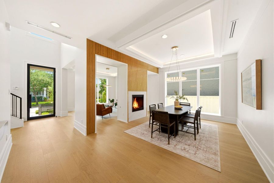 Refined formal dining space with designer lighting and seamless flow for entertaining. Refined formal dining space with designer lighting and seamless flow for entertaining.