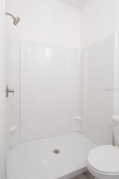 Primary bathroom with step in shower