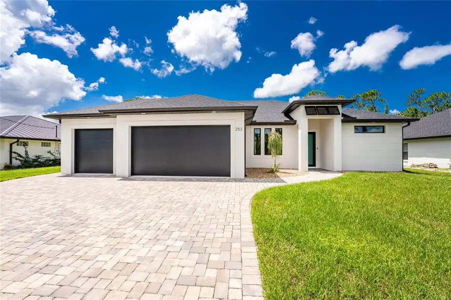 Front exterior of a new home in , Rotonda West, FL, highlighting curb appeal (Image 27).