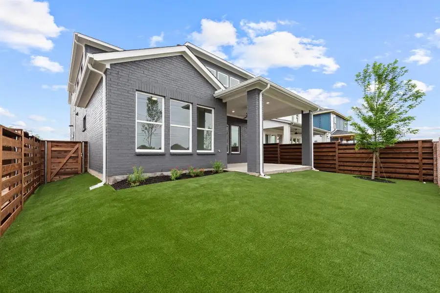 Exterior details and patio area of a home in Royal Court, Little Elm (Image 4).