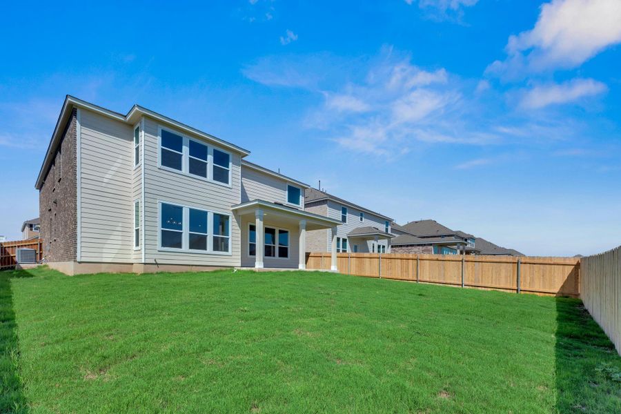 Front exterior of a new home in Salerno - Classic Collection, Round Rock, TX, highlighting curb appeal (Image 1). Front exterior of a new home in Salerno - Classic Collection, Round Rock, TX, highlighting curb appeal (Image 1).