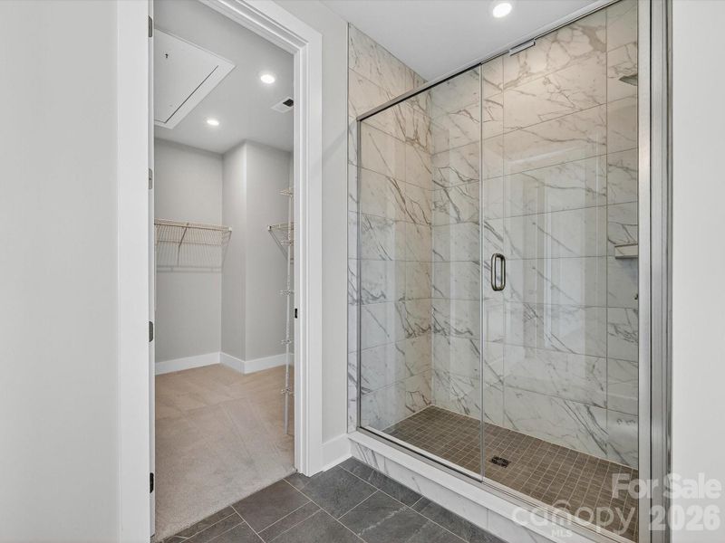Primary Bathroom with Tiled Shower Walls and Floor Pan