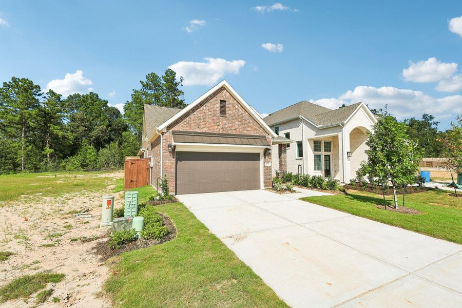 Front exterior of a new home in Evergreen 40s, Conroe, TX, highlighting curb appeal (Image 2). Front exterior of a new home in Evergreen 40s, Conroe, TX, highlighting curb appeal (Image 2).