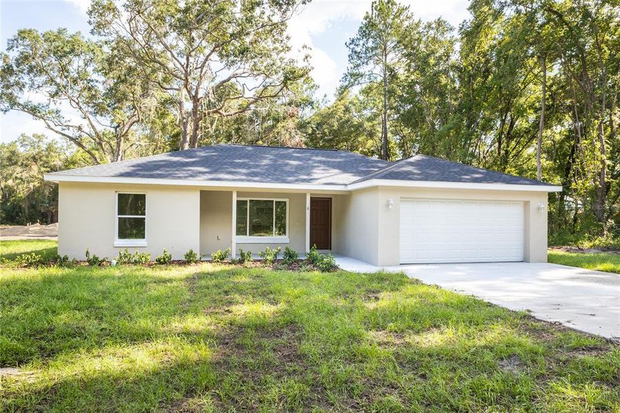 Front exterior of a new home in , Dunnellon, FL, highlighting curb appeal (Image 2). Front exterior of a new home in , Dunnellon, FL, highlighting curb appeal (Image 2).